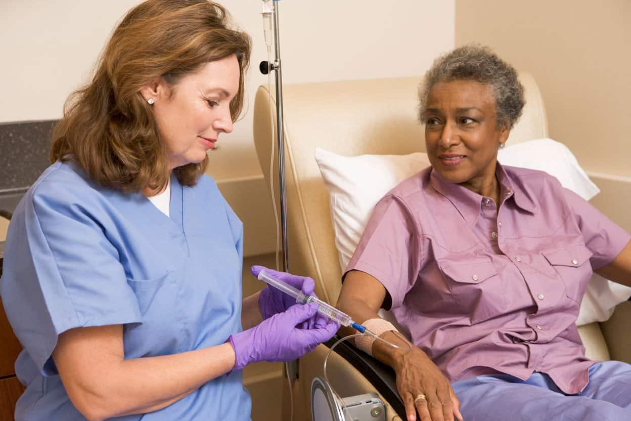 nurse with patient receiving infusion